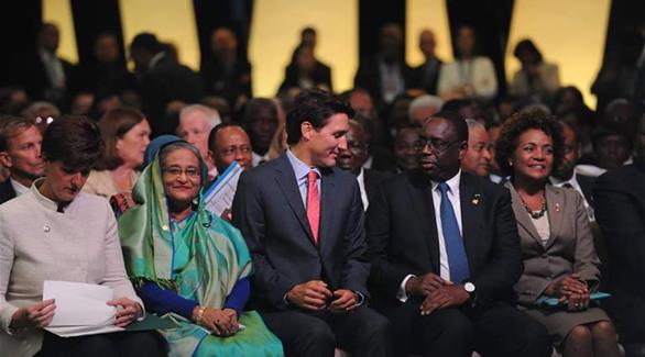 رئيس الوزراء الكندي، جاستين ترودو(في المنتصف) أثناء المؤتمر الدولي(تويتر)