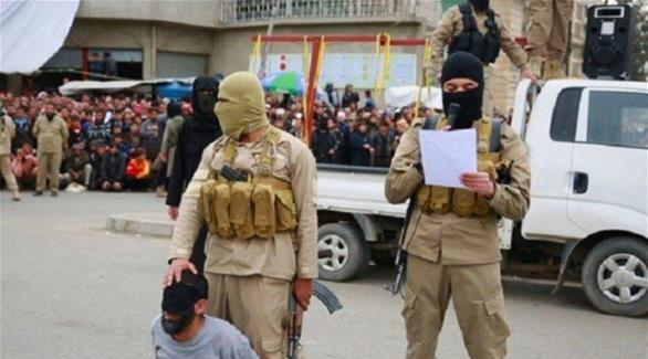 عناصر من داعش خلال إحدى عمليات الإعدام (أرشيف)