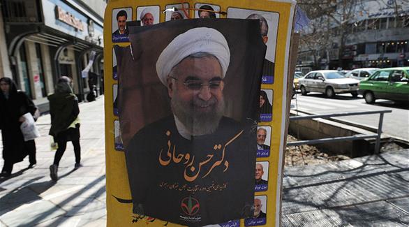 ملصق انتخابي للرئيس روحاني وسط طهران (غيتي)