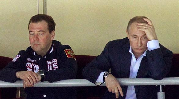 بوتين وبجانبه ميدفيديف (أرشيف / غيتي)