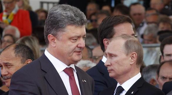الرئيس الروسي فلاديمير بوتين ونظيره الأوكراني بيترو بورشينكو(أرشيف)
