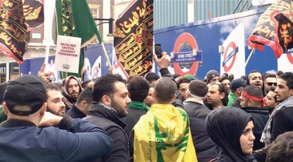 علام وشعارات حزب الله في مسيرة عاشوراء بلندن (الشرق الأوسط)
