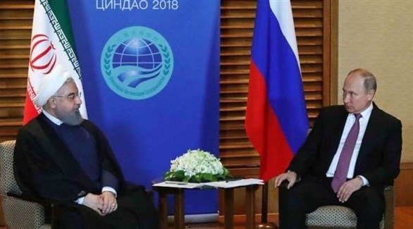 الرئيس الروسي فلاديمير بوتين والرئيس الإيراني حسن روحاني(وكالات)