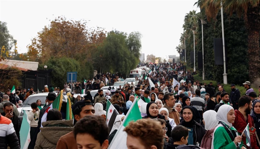 الاحتفال بالذكرى الأولى لسقوط نظام بشار الأسد في دمشق (رويترز)