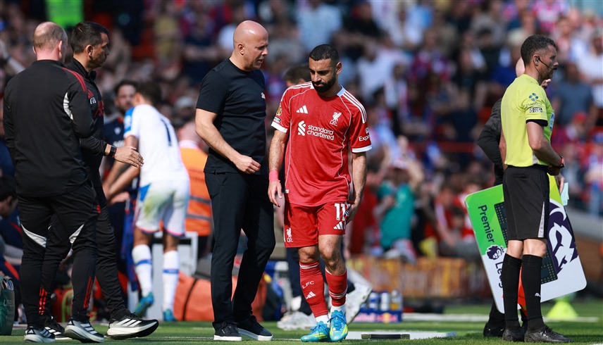 محمد صلاح وآرني سلوت (رويترز)